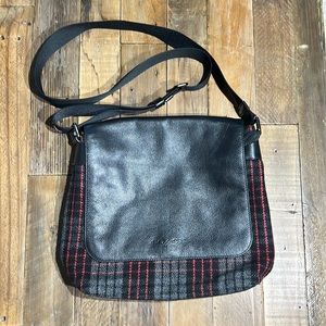 Coach messenger style crossbody bag in black leather and wool print.
